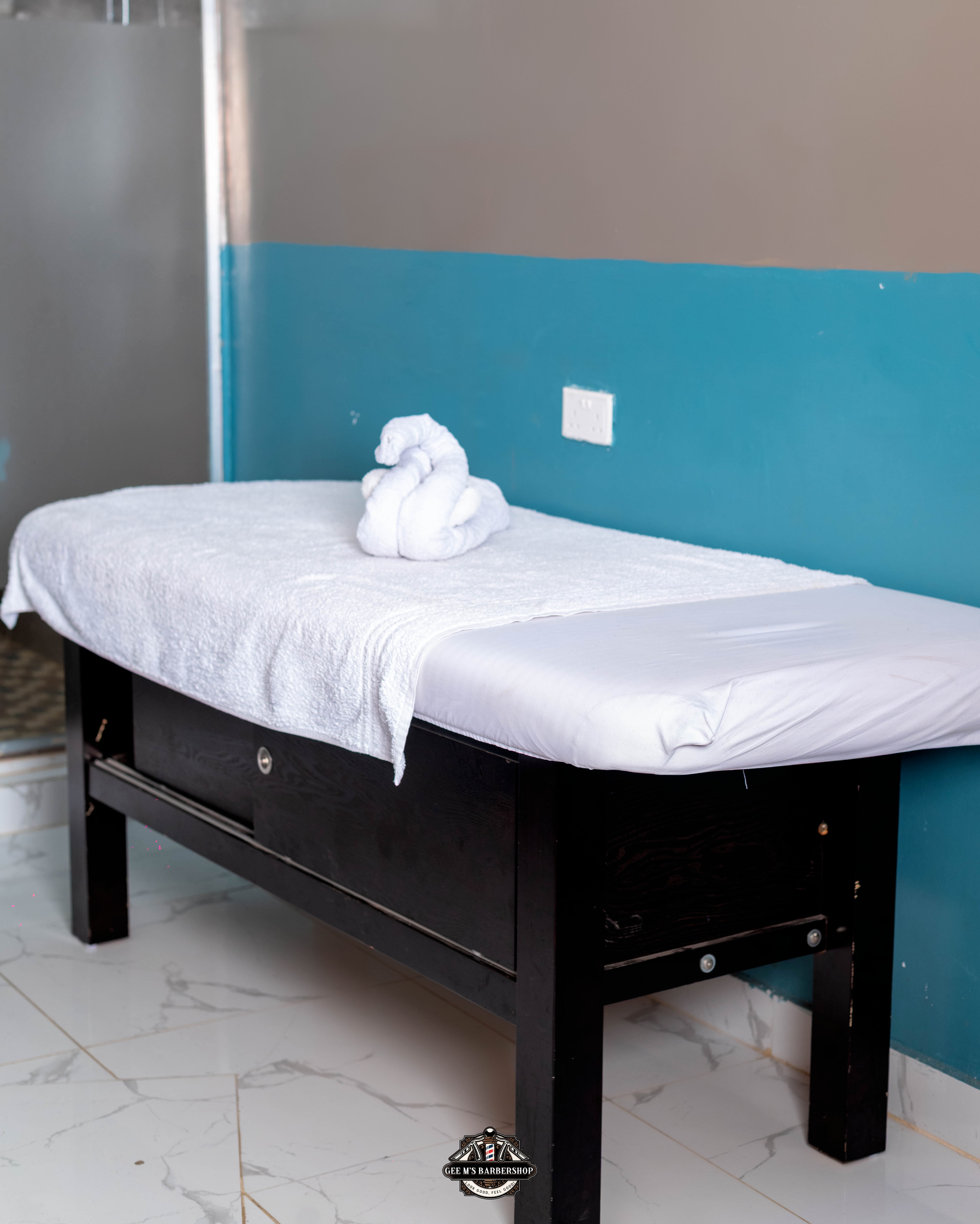 A facial treatment at GEE M'S Barbershop, Kilimani